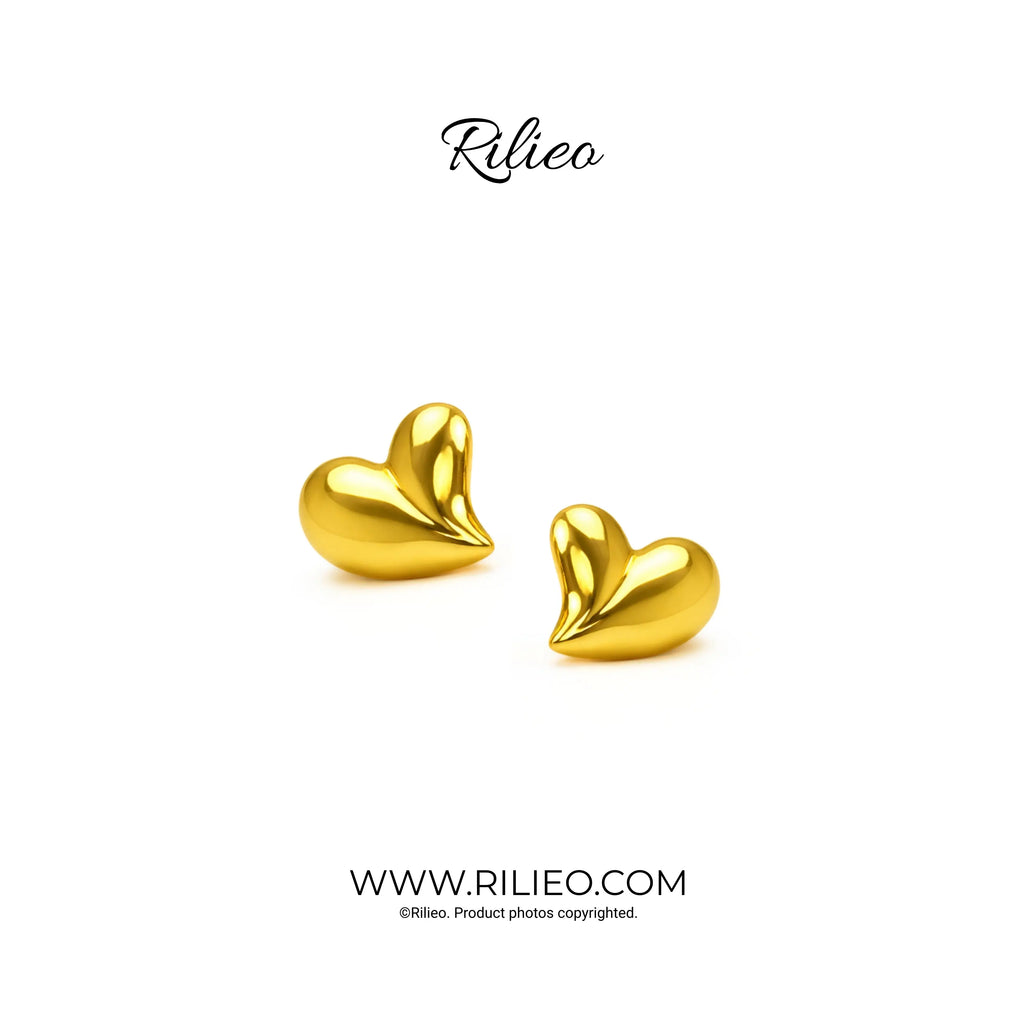 Shiny gold plated heart-shaped stud earrings on a white background