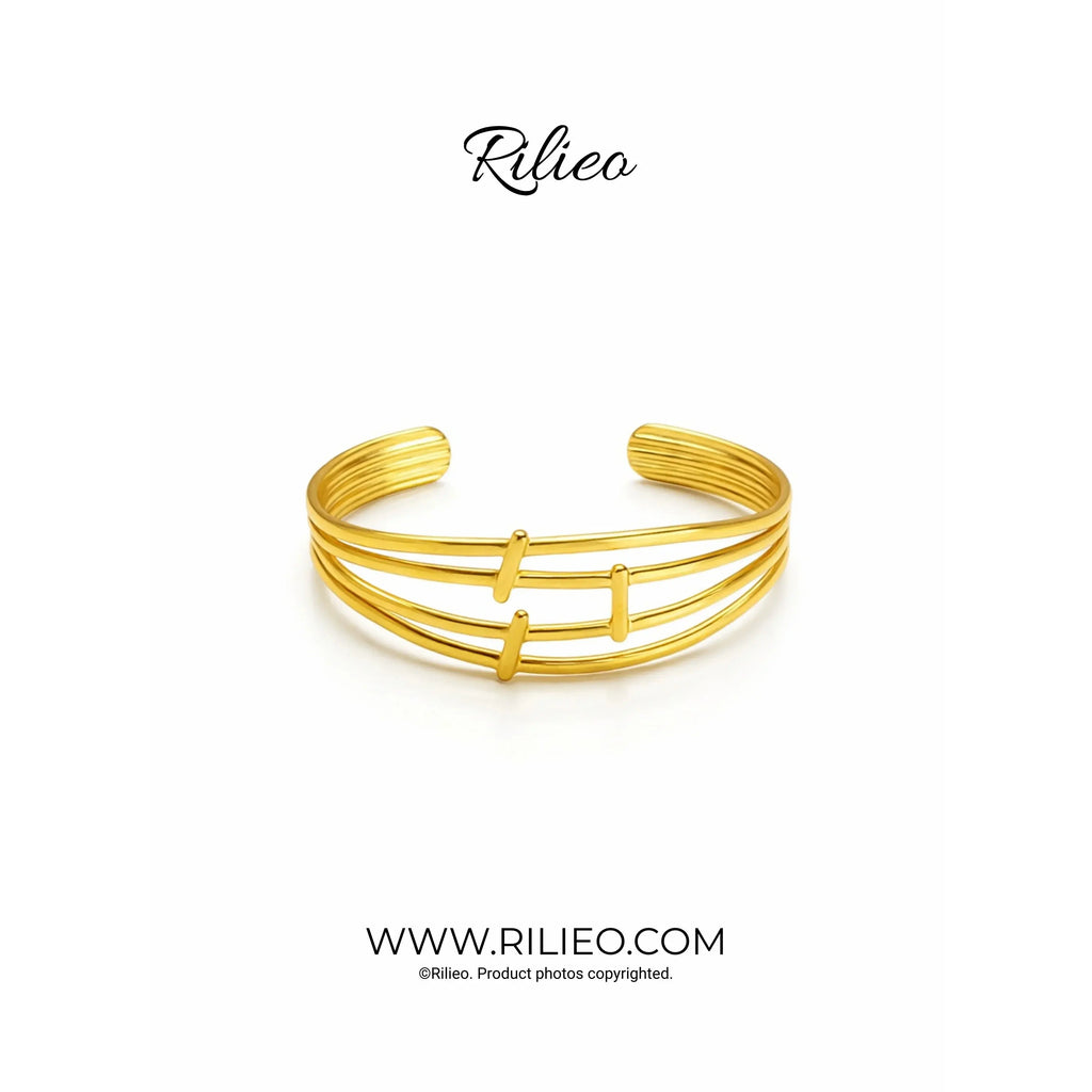 Three-band gold plated cuff bracelet with sleek minimalist design on white background