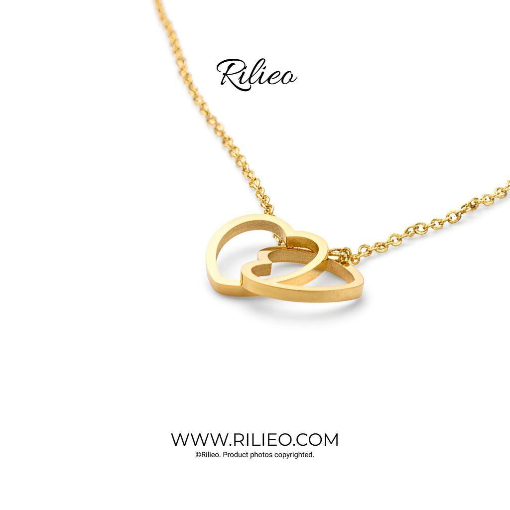 Gold plated double heart pendant necklace on a delicate chain, modern jewelry design